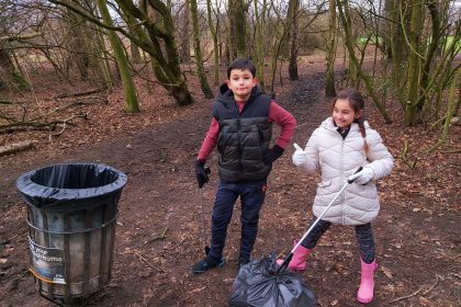 Ruben and Elena picking litter for 100 Acts of Kindness